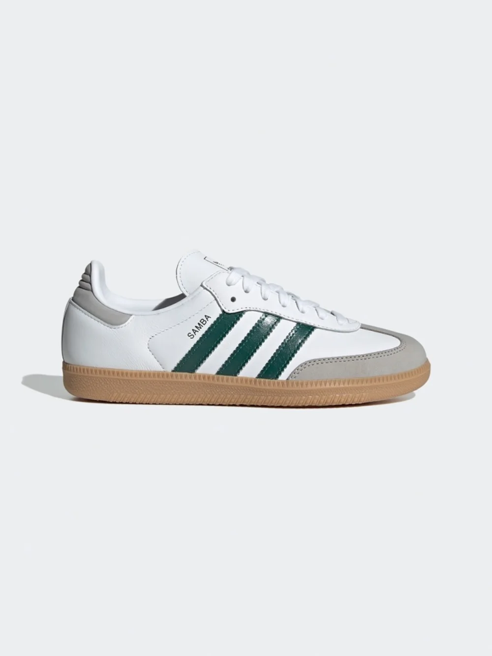White and green adidas Originals shoes